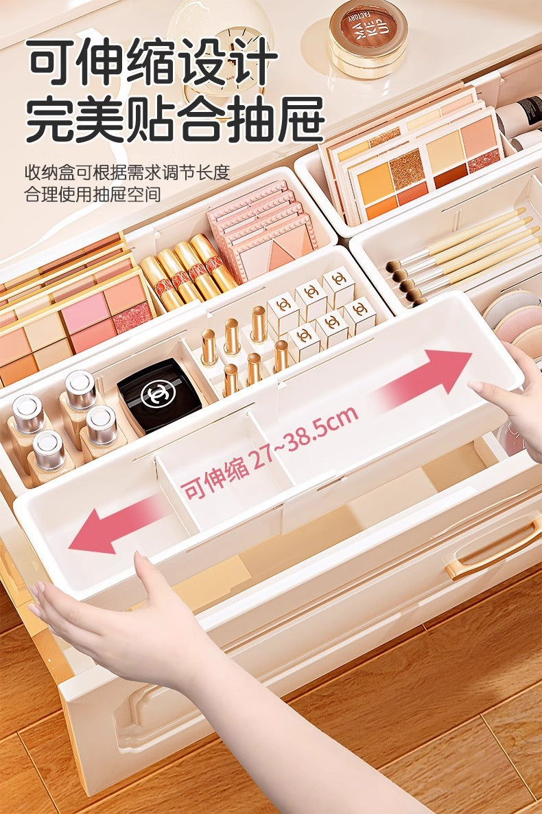 The storage box drawer is divided into built-in retractable rectangular compartments for cosmetics, lipsticks, snacks and small sundries