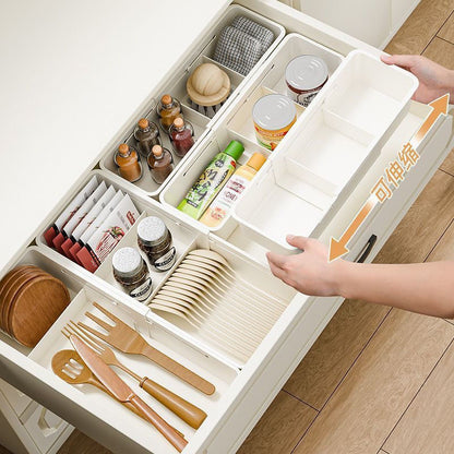 The storage box drawer is divided into built-in retractable rectangular compartments for cosmetics, lipsticks, snacks and small sundries